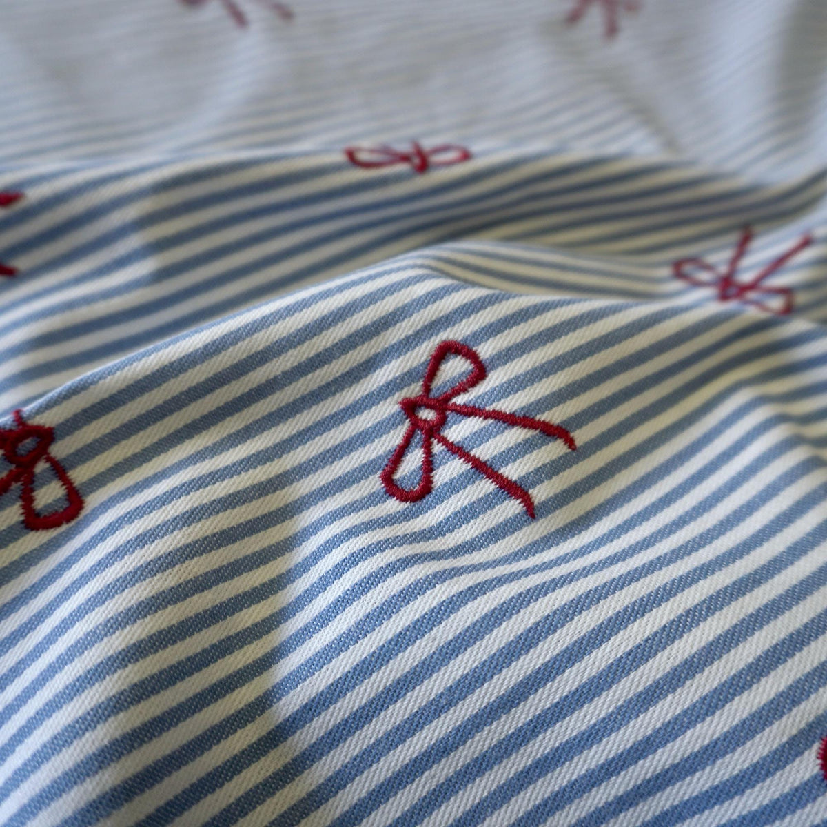 Valerie – Yarn dyed embroidery bows fabric